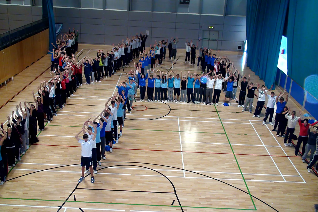 Hundreds of pupils from several primary schools at a skipping festival in a sports hall