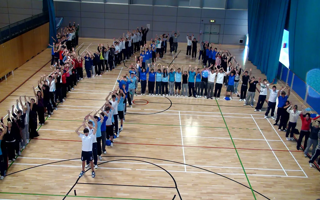 Pupils from several schools at a skipping festival in a sports hall